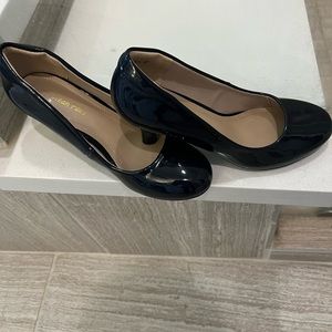 Patent leather navy pumps. Worn only 2 times. Negotiable a little on price.